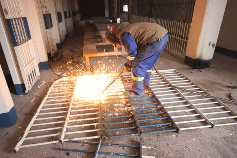 Priestly Demolition Welder Cutting Don Jail Cell Door